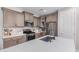 Modern kitchen with stainless steel appliances, ample counter space, and stylish cabinetry at 2499 S Entwistle St, Gilbert, AZ 85295