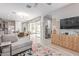 Open-concept living room with seamless access to the dining area and outdoor living space at 2499 S Entwistle St, Gilbert, AZ 85295