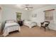 Bedroom featuring two twin beds, a ceiling fan, and natural light at 28 E 14Th St, Tempe, AZ 85281