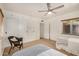 Spacious bedroom features built-in closet storage, a ceiling fan, and a wicker chair at 28 E 14Th St, Tempe, AZ 85281