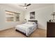 Bright bedroom with a ceiling fan, window with blinds, and modern decor at 28 E 14Th St, Tempe, AZ 85281