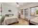 Bedroom with natural light, a ceiling fan, wood floors, and beadboard walls at 28 E 14Th St, Tempe, AZ 85281