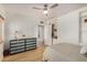 Bedroom with wood flooring, beadboard walls, and built-in closet shelves at 28 E 14Th St, Tempe, AZ 85281