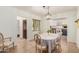 Well-lit dining room featuring tile flooring and a decorative light fixture and classic furniture at 28 E 14Th St, Tempe, AZ 85281