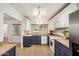 Updated kitchen featuring two-tone cabinetry, tiled floors, modern appliances, and ample counter space at 28 E 14Th St, Tempe, AZ 85281