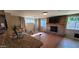 Cozy living room with a brick fireplace and a flat-screen TV at 3526 E Piccadilly Rd, Phoenix, AZ 85018