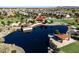Stunning aerial view of community lake with covered seating areas, perfect for relaxing and enjoying the outdoors at 3664 E Narrowleaf Dr, Gilbert, AZ 85298