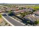 Scenic aerial view showcasing a desert home with a private pool and well-maintained landscaping, nestled in a quiet neighborhood at 3664 E Narrowleaf Dr, Gilbert, AZ 85298