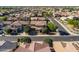 A beautifully landscaped home is nestled in an upscale community with mature trees at 3664 E Narrowleaf Dr, Gilbert, AZ 85298