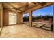 A covered back patio features tiled flooring, outdoor ceiling fans, and artificial turf at 3664 E Narrowleaf Dr, Gilbert, AZ 85298