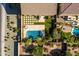 Captivating aerial view of a backyard with a pristine pool, artificial grass, and mature desert landscaping at 3664 E Narrowleaf Dr, Gilbert, AZ 85298