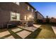 A backyard barbecue area features seating, built in grill and plenty of room for entertaining at 3664 E Narrowleaf Dr, Gilbert, AZ 85298