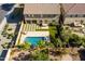 Stunning backyard featuring a sparkling pool, lush green grass, desert landscaping and ample space for outdoor enjoyment at 3664 E Narrowleaf Dr, Gilbert, AZ 85298