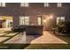 A backyard barbecue area features seating, built in grill and lush landscaping at 3664 E Narrowleaf Dr, Gilbert, AZ 85298