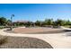 Outdoor community basketball court with new pavement, lighting and mature shade trees at 3664 E Narrowleaf Dr, Gilbert, AZ 85298