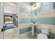 Charming powder room boasts stylish striped walls and a pedestal sink at 3664 E Narrowleaf Dr, Gilbert, AZ 85298
