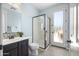 Stylish bathroom features a walk-in shower, modern vanity, and plenty of natural light at 3664 E Narrowleaf Dr, Gilbert, AZ 85298