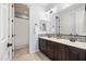 Bright bathroom featuring a double vanity, decorative tile backsplash, and a shower-tub combination at 3664 E Narrowleaf Dr, Gilbert, AZ 85298