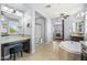 Bright bathroom with a vanity and stool, walk-in shower, and soaking tub at 3664 E Narrowleaf Dr, Gilbert, AZ 85298