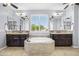 Bright bathroom showcasing a soaking tub between matching dual vanities with granite countertops at 3664 E Narrowleaf Dr, Gilbert, AZ 85298