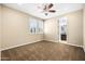 Light and airy bedroom with neutral walls, a ceiling fan, and bright windows with white shutters at 3664 E Narrowleaf Dr, Gilbert, AZ 85298