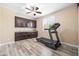 Versatile room with built-in cabinets, a ceiling fan, and a treadmill at 3664 E Narrowleaf Dr, Gilbert, AZ 85298
