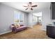 Bonus room with a chaise lounge, a wet bar, bright windows, and a ceiling fan at 3664 E Narrowleaf Dr, Gilbert, AZ 85298