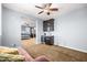 Open bonus room with a wet bar, chaise lounge, a view to main bedroom, and a ceiling fan at 3664 E Narrowleaf Dr, Gilbert, AZ 85298