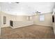 Bright bonus room with multiple windows, ceiling fan, and neutral colors offers the perfect space for relaxing and entertaining at 3664 E Narrowleaf Dr, Gilbert, AZ 85298