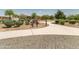 Picturesque community park featuring a walking path, playground, shaded seating, and verdant desert landscaping at 3664 E Narrowleaf Dr, Gilbert, AZ 85298