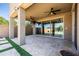 Spacious covered patio with ceiling fans, recessed lighting, and a view of the beautifully landscaped backyard at 3664 E Narrowleaf Dr, Gilbert, AZ 85298
