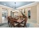 Chic dining area showcasing a dining table with modern chandelier and views to the staircase at 3664 E Narrowleaf Dr, Gilbert, AZ 85298