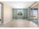 Bright dining area boasts stylish curtains, a modern chandelier, and a sliding door for easy outdoor access at 3664 E Narrowleaf Dr, Gilbert, AZ 85298