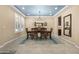 Bright dining room boasts plantation shutters and modern lighting, perfect for Gathering gatherings at 3664 E Narrowleaf Dr, Gilbert, AZ 85298