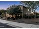 Two-story home showcasing a well-maintained yard, stone accents, and a basketball hoop on the side at 3664 E Narrowleaf Dr, Gilbert, AZ 85298