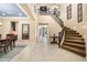 Grand foyer with a curved staircase, tile floors, and high ceilings at 3664 E Narrowleaf Dr, Gilbert, AZ 85298