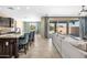 Open-concept living space featuring a modern kitchen, stylish seating, and access to the backyard at 3664 E Narrowleaf Dr, Gilbert, AZ 85298