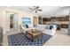 Open-concept living area features a spacious sectional, backyard access, and seamless flow to the kitchen at 3664 E Narrowleaf Dr, Gilbert, AZ 85298
