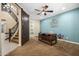 Stylish office with a rustic barn door, modern desk, and staircase view at 3664 E Narrowleaf Dr, Gilbert, AZ 85298