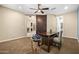Comfortable home office featuring a decorative globe and views into another room through barn doors at 3664 E Narrowleaf Dr, Gilbert, AZ 85298
