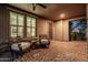 Cozy covered patio with brick flooring, comfortable seating, and views of the home's exterior at 3664 E Narrowleaf Dr, Gilbert, AZ 85298