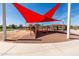 Community playground with vibrant red sunshade, providing safe and enjoyable outdoor play at 3664 E Narrowleaf Dr, Gilbert, AZ 85298