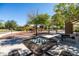 Community playground with picnic tables, climbing equipment, swings and beautiful mature trees for shade at 3664 E Narrowleaf Dr, Gilbert, AZ 85298