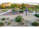 Community playground featuring modern equipment, sand area, and shaded picnic spot at 3664 E Narrowleaf Dr, Gilbert, AZ 85298