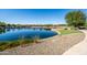 Beautiful pond with walking path, mature trees, and attractive landscaping in a desirable community at 3664 E Narrowleaf Dr, Gilbert, AZ 85298