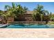 Pool featuring a rock waterfall and basketball hoop at 3664 E Narrowleaf Dr, Gilbert, AZ 85298