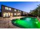 A backyard pool and spa features ample space, outdoor seating, and green pool lighting at 3664 E Narrowleaf Dr, Gilbert, AZ 85298