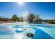Fun splash pad with water fountains and a playground with swings, climbing structures and covered seating nearby at 3664 E Narrowleaf Dr, Gilbert, AZ 85298