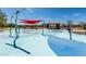 Community splash pad with colorful water features and shaded picnic tables, perfect for Gathering fun at 3664 E Narrowleaf Dr, Gilbert, AZ 85298