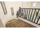 Elegant staircase featuring carpeted steps, a black railing, and a modern chandelier at 3664 E Narrowleaf Dr, Gilbert, AZ 85298